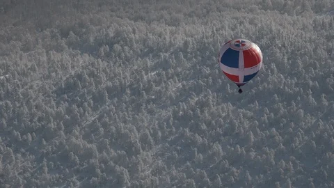 Balloon over the mountains, Bashkortostan, winter Stock Footage 102329846