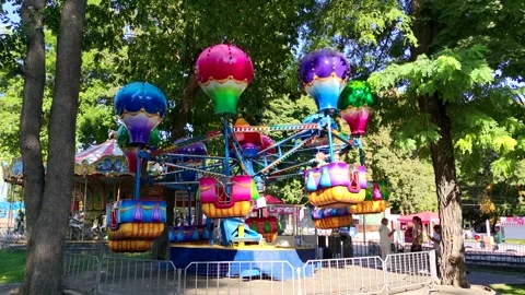 Balloon shaped carousel in fairground Stock-Footage 283395216