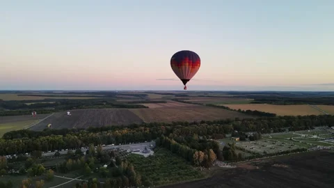Balloon sits down smoothly at sunset Video stock 168347127
