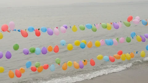 Balloon String Shooting Game near sea Stock Footage 106402701