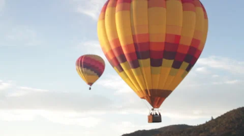 Balloon tilt up pan right to sky hot air balloons in california wine country  Stock Footage 35403107