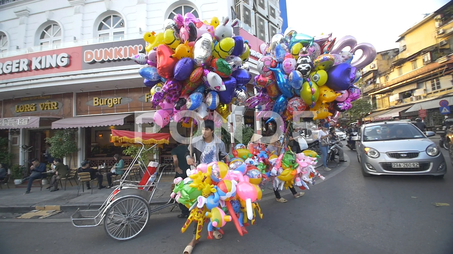 Woman selling Louis Vuitton balloons in Ho Chi Minh City Stock