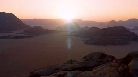 Ballooning in a hot air balloon to fly through the Wadi Rum desert at dawn. Stock Footage 283798231