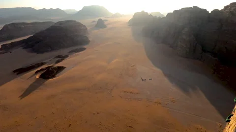 Ballooning in a hot air balloon to fly through the Wadi Rum desert at dawn. Stock Footage 283798310