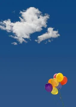 Balloons and clouds in the blue sky Stock Photos