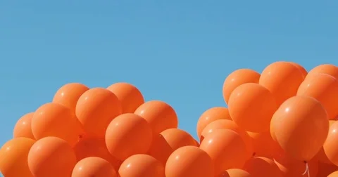 Balloons on a background of blue sky. a lot of balloons in the sky Stock Footage 77679674