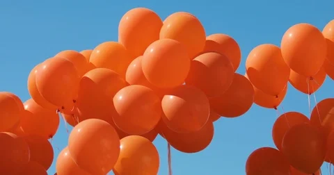 Balloons on a background of blue sky. a lot of balloons in the sky Stock Footage 77680233