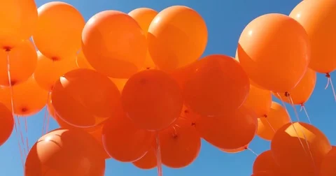 Balloons on a background of blue sky. a lot of balloons in the sky Stock Footage 77680451