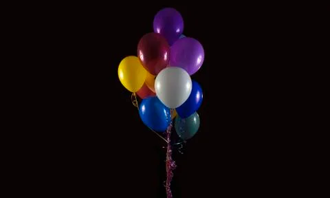 Balloons on black background Stock Illustration