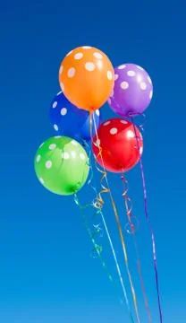 Balloons on a blue background Stock Photos