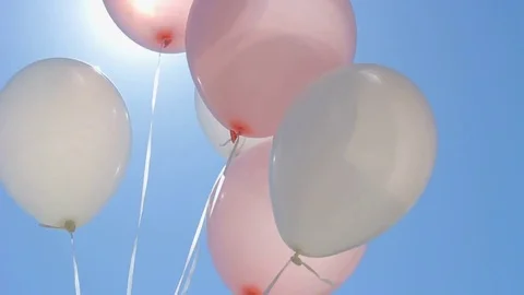 Balloons on blue sky background Stock Footage 79265072