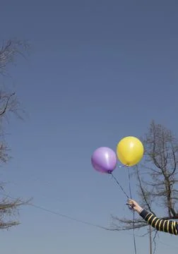 Balloons on a blue sky background with sun highlights 스톡 사진