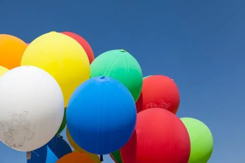 Balloons on blue sky Stock Photos