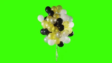 Balloons in different colors on green background. Stock Footage 30394338