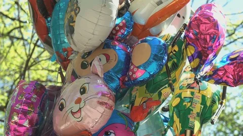 Balloons in the different shapes in the sky Видео 70289912