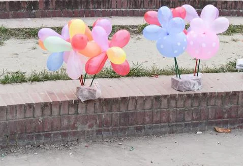 Balloons display on footpath Foto stock