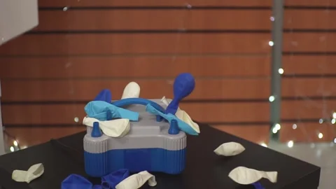 Balloons fall on the table Stock Footage 229619622