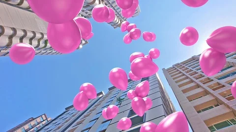 Balloons floating up with buildings background 库存影片 113442329