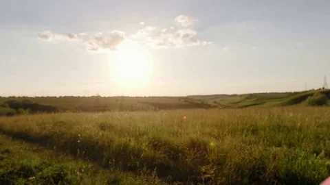 Balloons on a green meadow at sunset. Concept - lightness and freedom of Video stock 76157221