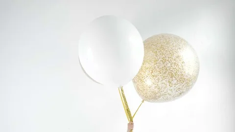 Balloons in hand. Hand is out of focus 1080p fullHD Video stock 75890992