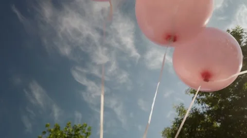 Balloons moving on a background of blue sky. Stock Footage 198373864