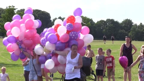 Balloons released in memory of Manchester bomb attack hero Kelly Brewster - INT Stock Footage 148651745