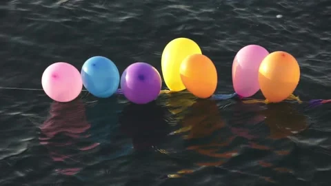 Balloons in shooting range as targets on water Stock Footage 218620824