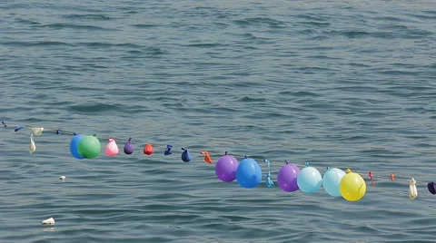 Balloons in a shooting in the seaside Stock Footage 64915790