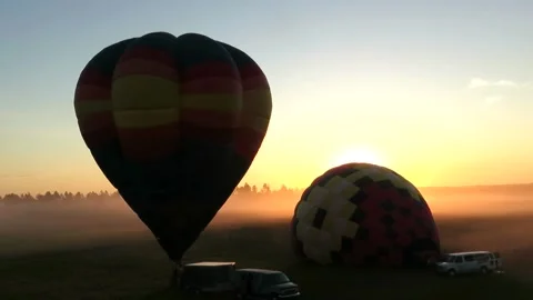 Balloons with the sun rising behind Stock Footage 173279706