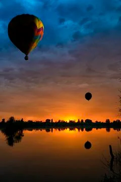 Balloons at sunset Stock Photos