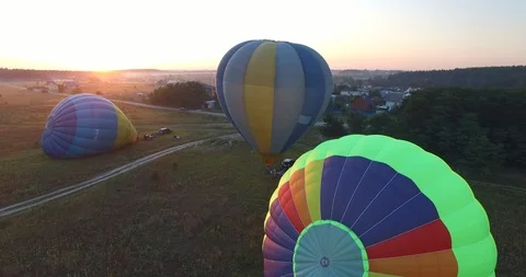 Balloons take off against the background of the rising sun Stock Footage 86191668