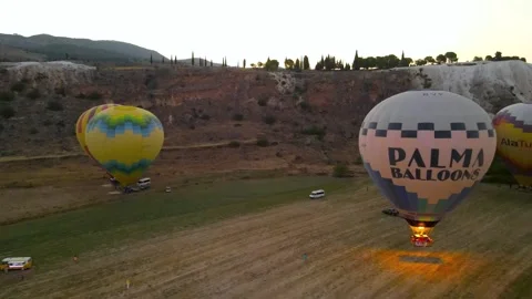 Balloons take off against the background of the rising sun in Turkey Stock Footage 214857191