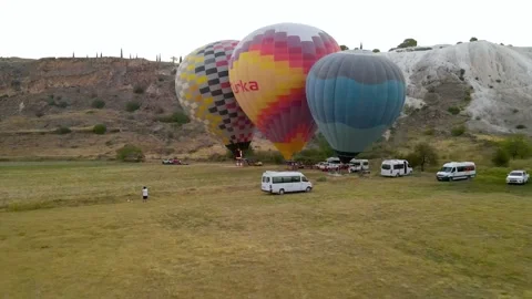 Balloons take off against the background of the rising sun in Turkey Stock Footage 214857403