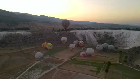 Balloons take off against the background of the rising sun in Turkey Stock Footage 214865733