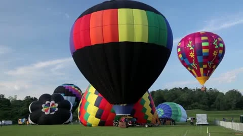 Balloons take off from ground Stock Footage 20484077