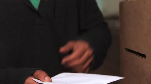 Ballot Box, Man casting Vote in the Voting Center. Close Up. Stock Footage 83670642