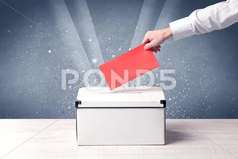 Ballot box with person casting vote Stock Photos