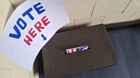 Ballot paper inserted into black box for election voting process here Foto stock