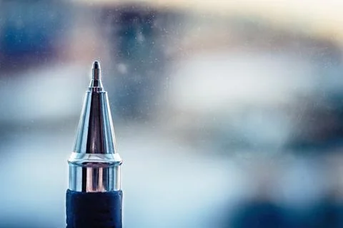 Ballpoint pen on the background of the window. Stock Photos