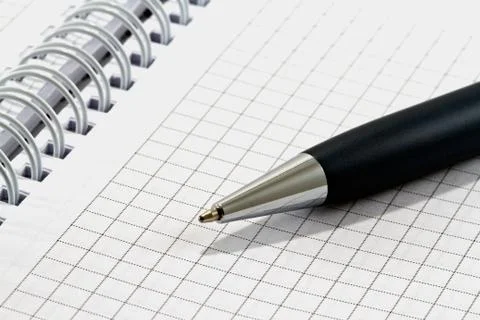 Ballpoint pen on checked notebook paper 스톡 사진