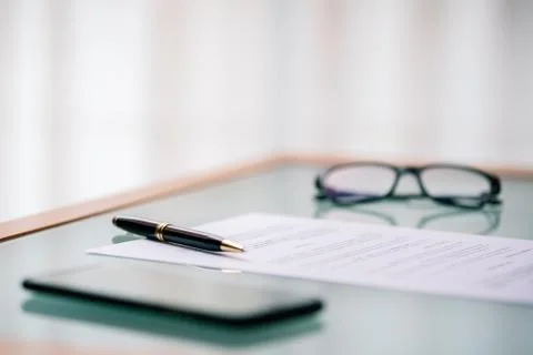 Ballpoint pen on document or contract on a table Foto stock
