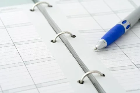 Ballpoint pen on notebook Stock Photos