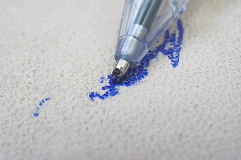 Ballpoint pen tip, scribbling on a white leather 写真素材