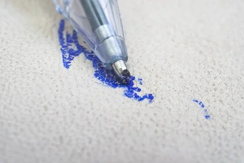 Ballpoint pen tip, scribbling on a white leather sofa 写真素材