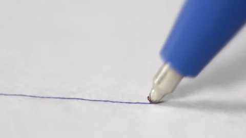 Ballpoint pen writes or draws on paper Stock Footage 97857474