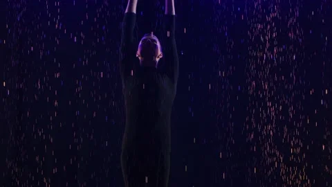 Ballroom male dancer performs elements of the Latin dance bachata in the rain Stock Footage 150508528
