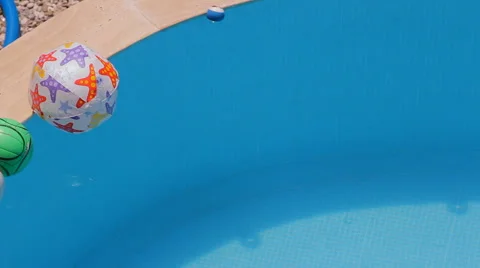 Balls are swimming in the pool Stock Footage 43673292