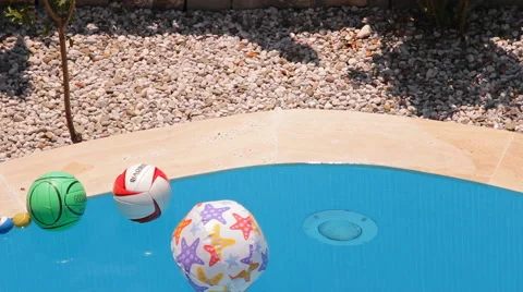 Balls, balls floating in the water in the pool Stock Footage 43045683