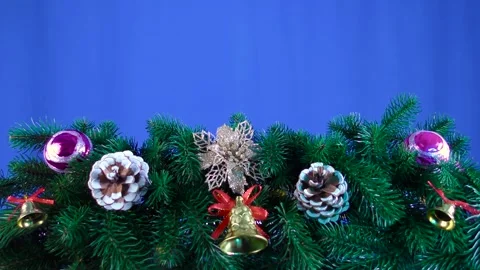 Balls of bells and cones on the branches of a Christmas tree Stock Footage 255679113