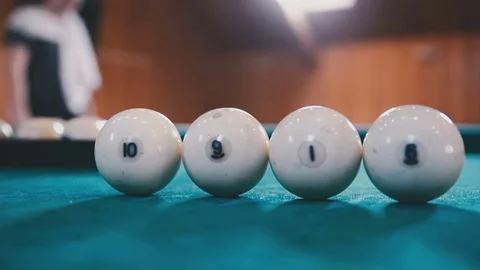Balls for billiards are on the table in a row Stock Footage 81543866